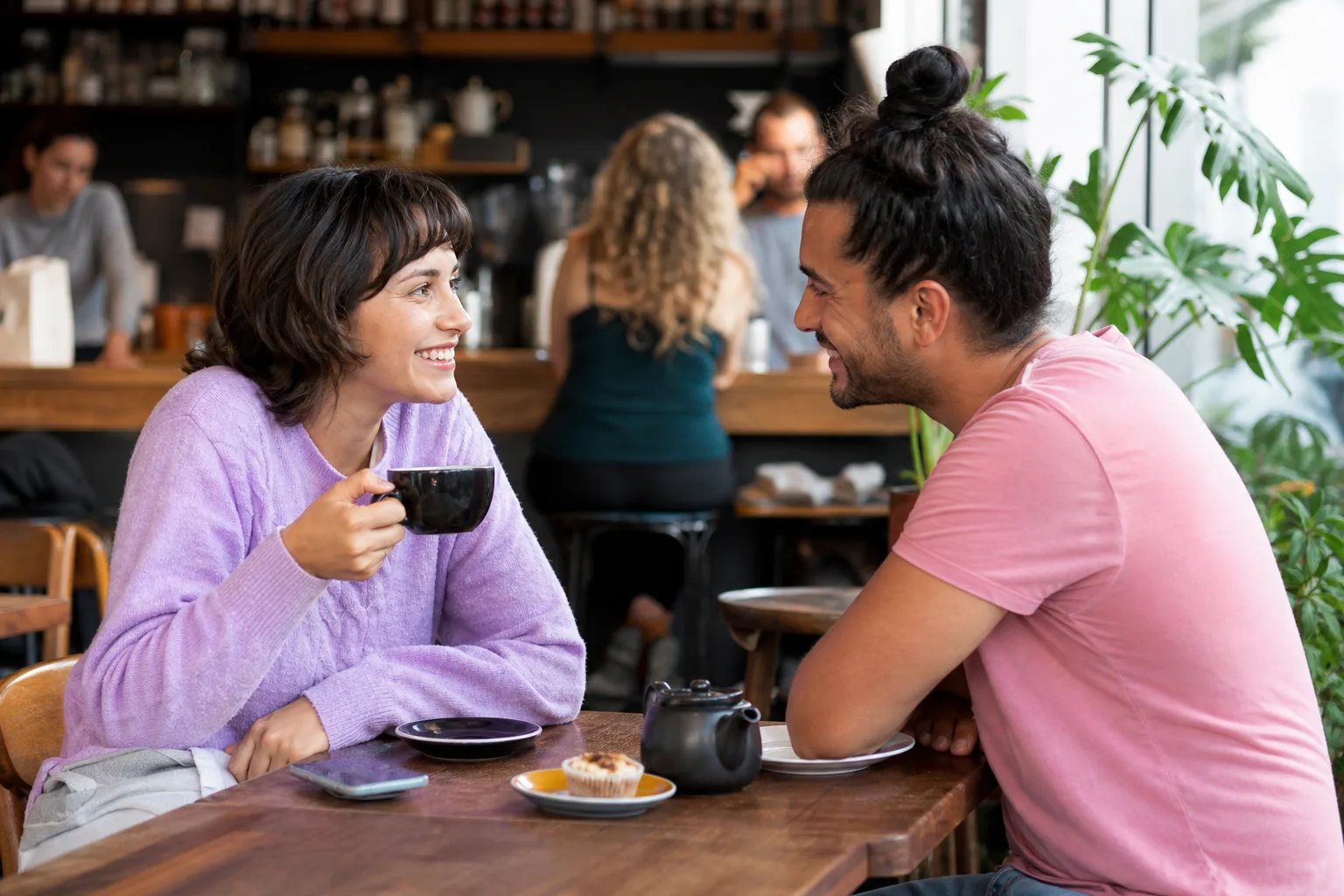 Two single adults chatting over coffee in Peterborough city centre
